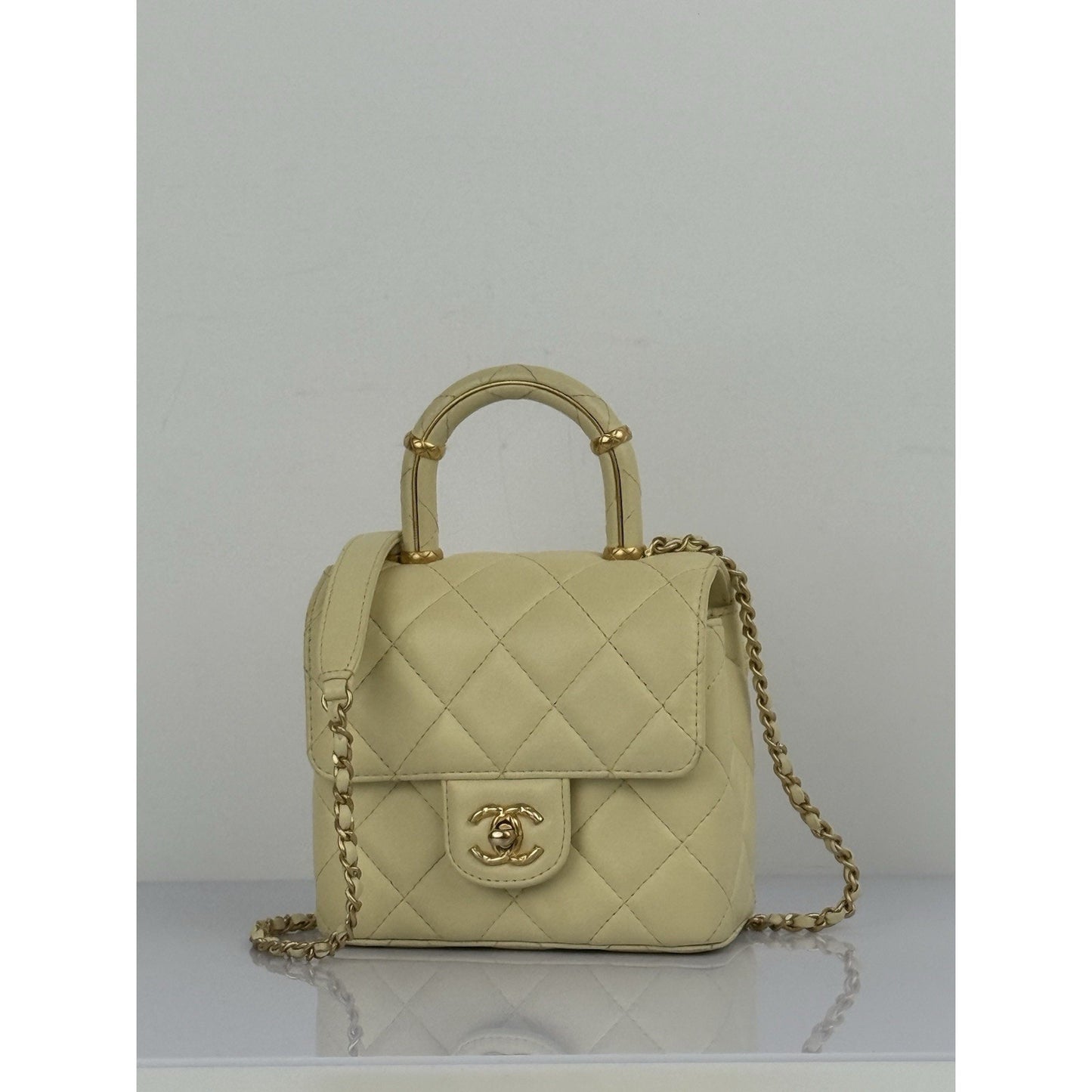 CHANEL Crush Quilted Leather Mini Top Handle Flap Bag in Yellow