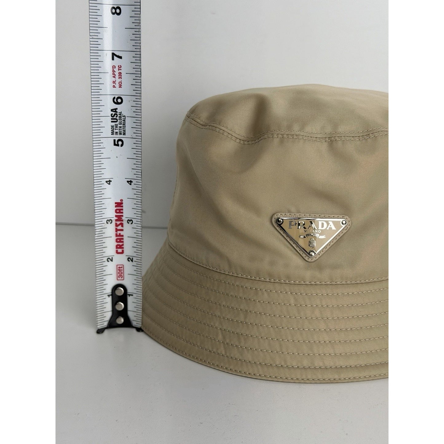 Prada Re-Nylon Bucket Hat Desert Beige & Metal Triangle Logo K3