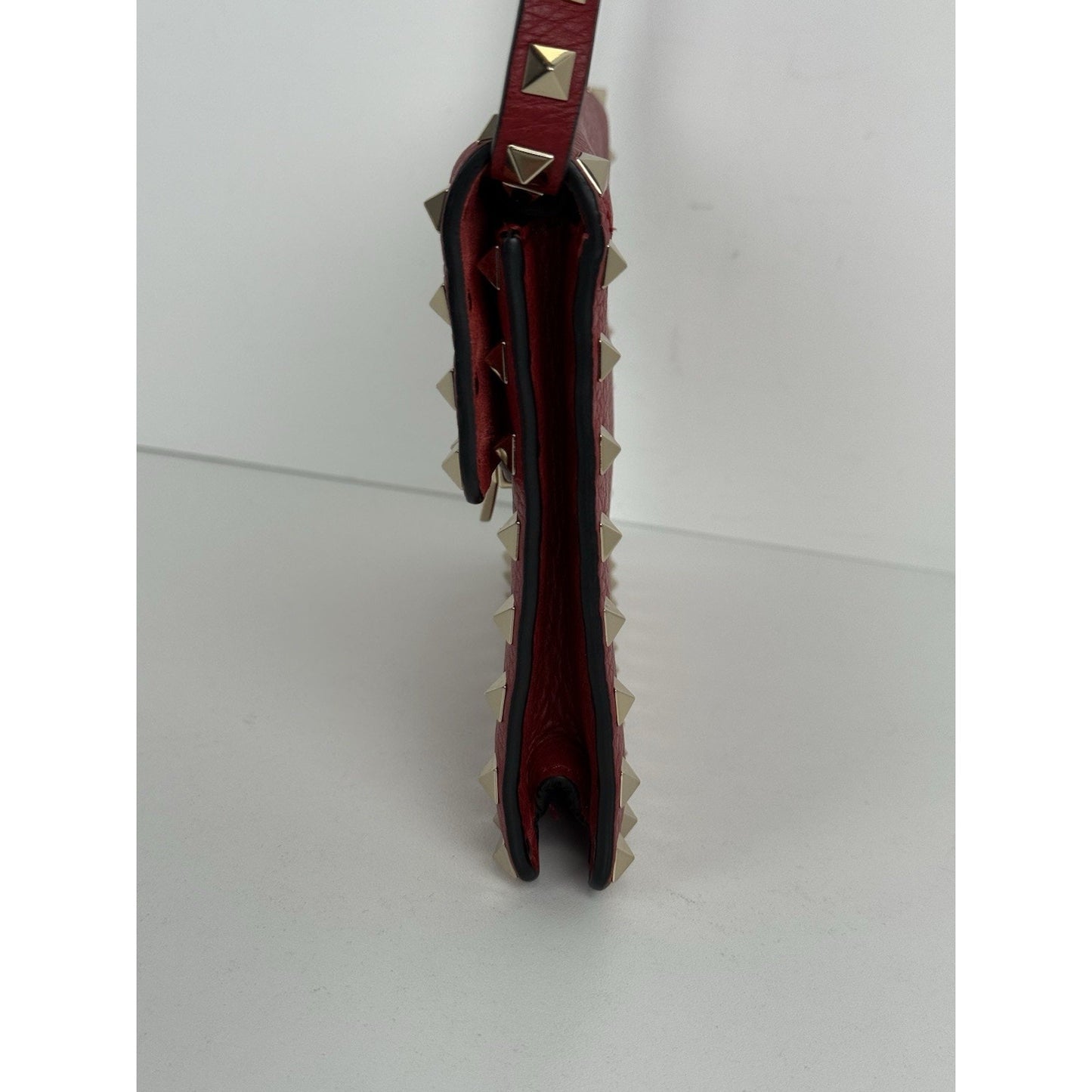 VALENTINO GARAVANI Pebbled Calfskin Medium Rockstud Rouge