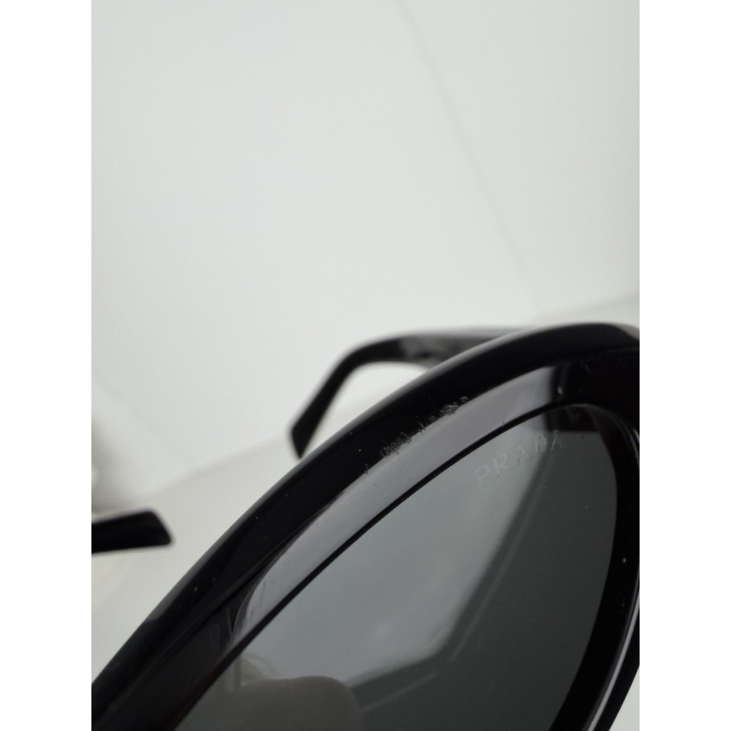 Prada Symbole Oval Car-Eye Sunglasses 55 in Black with Dark Gray Lenses