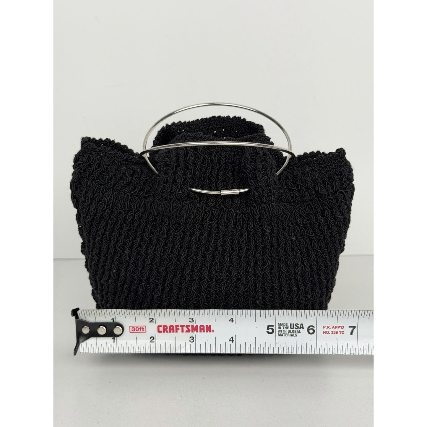 The Row Flat Micro Circle Bag in Black S08