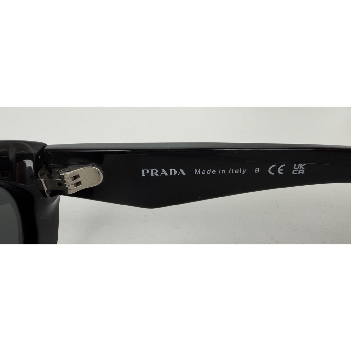 Prada Symbole Oval Car-Eye Sunglasses 55 in Black with Dark Gray Lenses