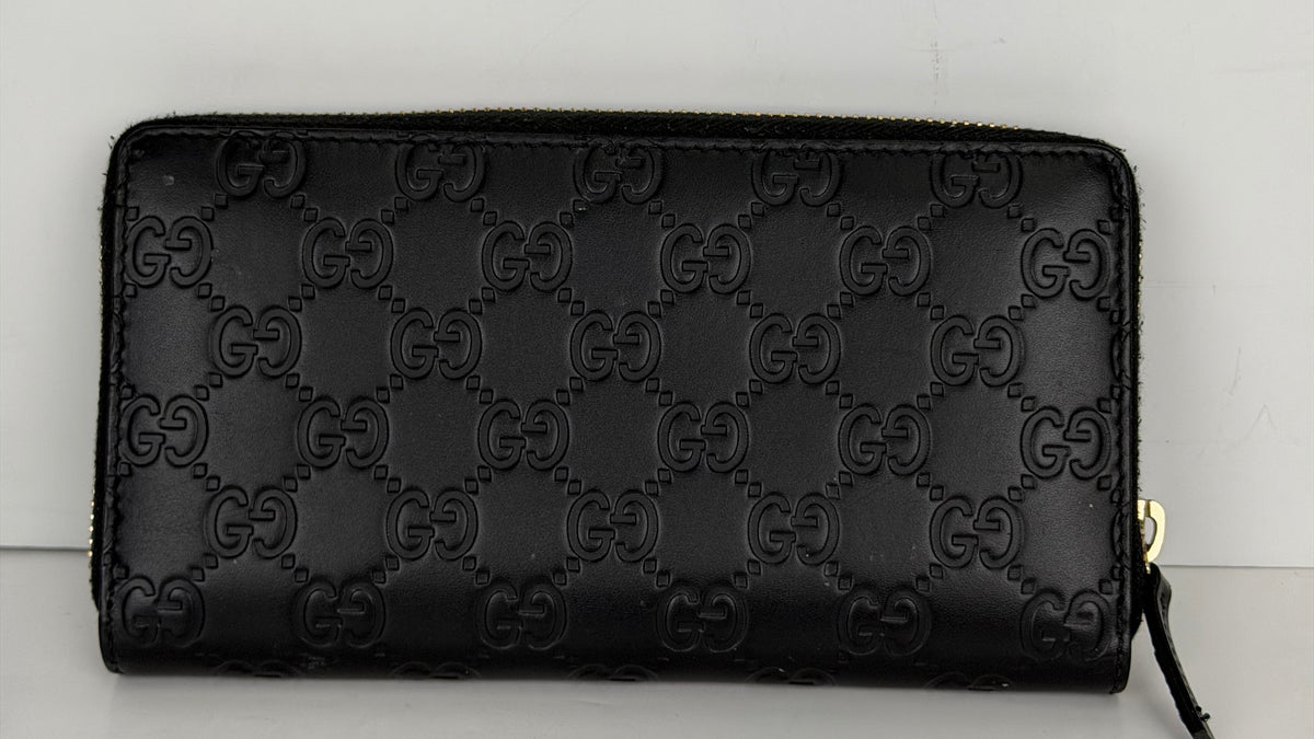 Gucci Guccissima Bow Zip Around Wallet in Black Leather Y