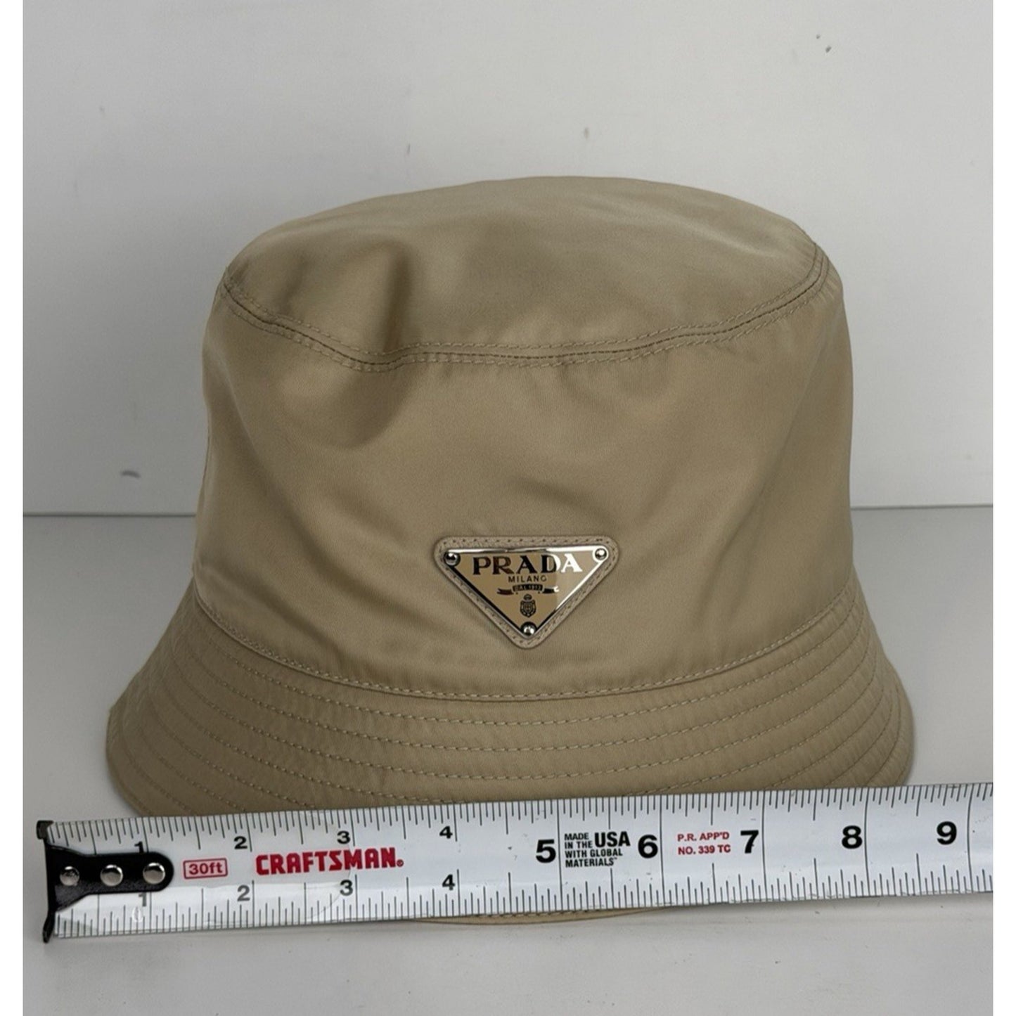 Prada Re-Nylon Bucket Hat Desert Beige & Metal Triangle Logo K3