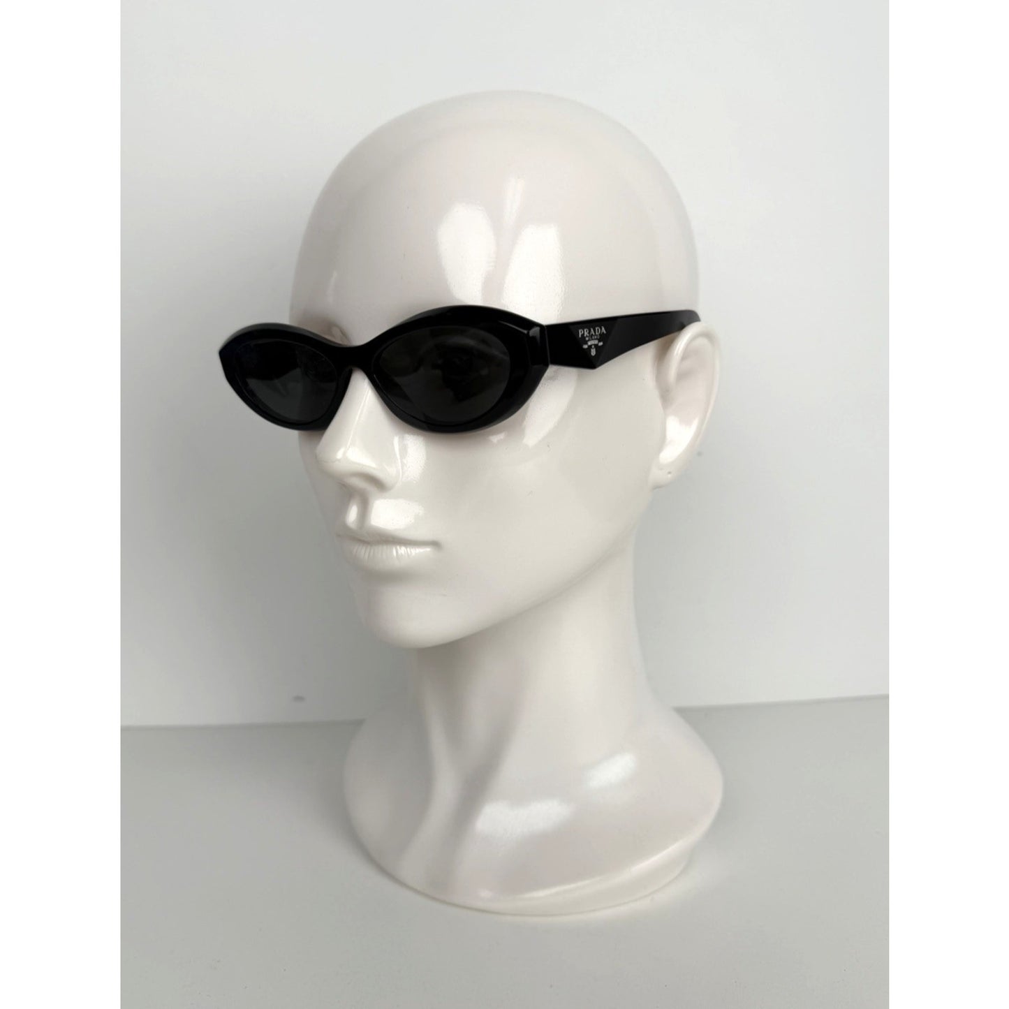 Prada Symbole Oval Car-Eye Sunglasses 55 in Black with Dark Gray Lenses