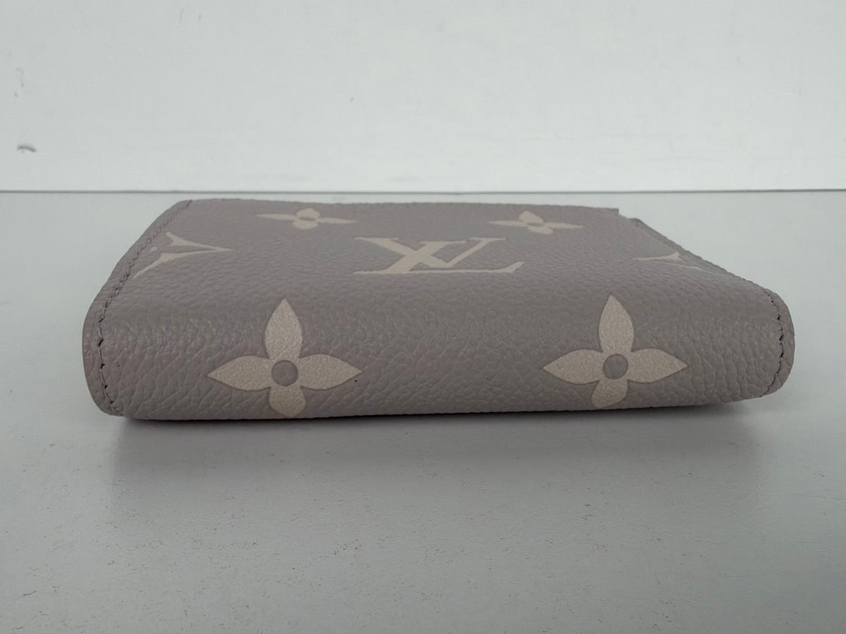 Louis Vuitton Lisa Wallet in Dust Pink Empreinte Leather NFC K-3