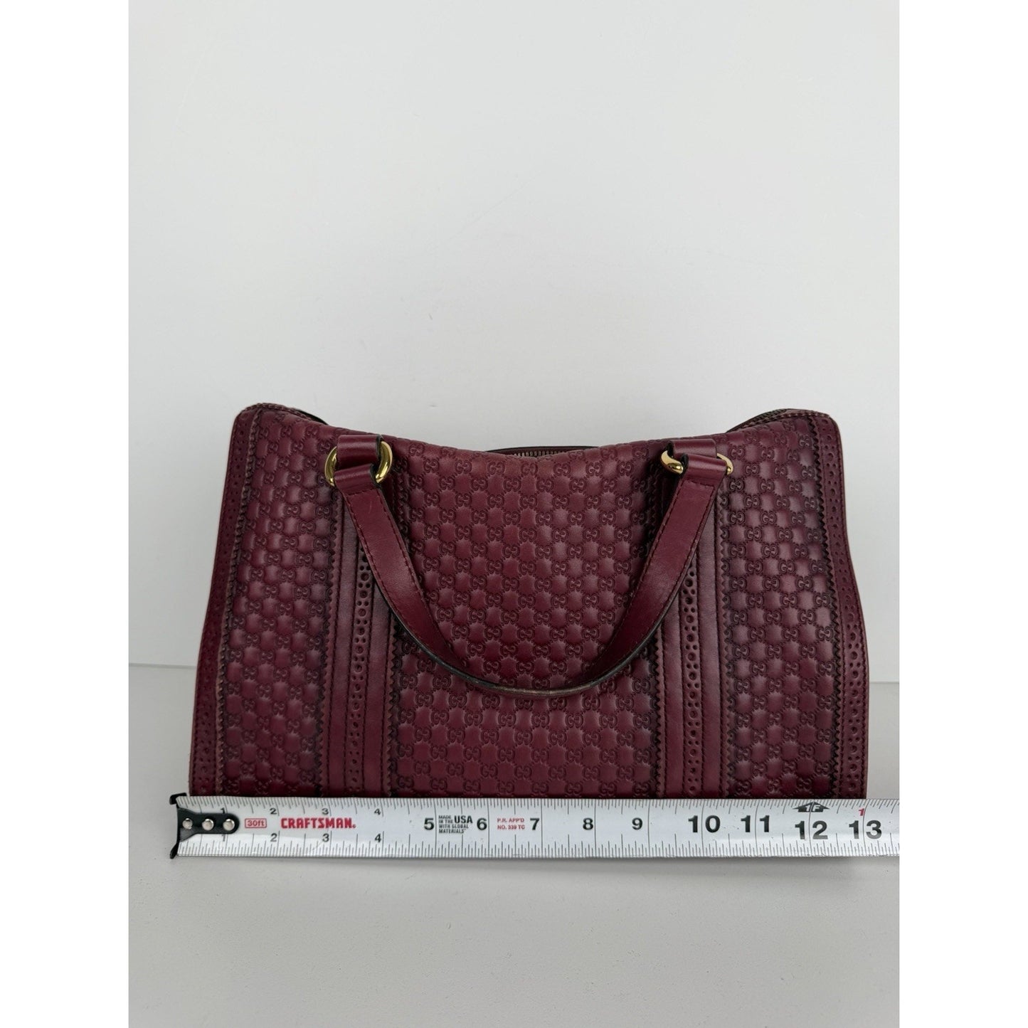 Gucci Duilio Brogue Boston Bag in Burgundy Microguccissima Embossed Leather S-16