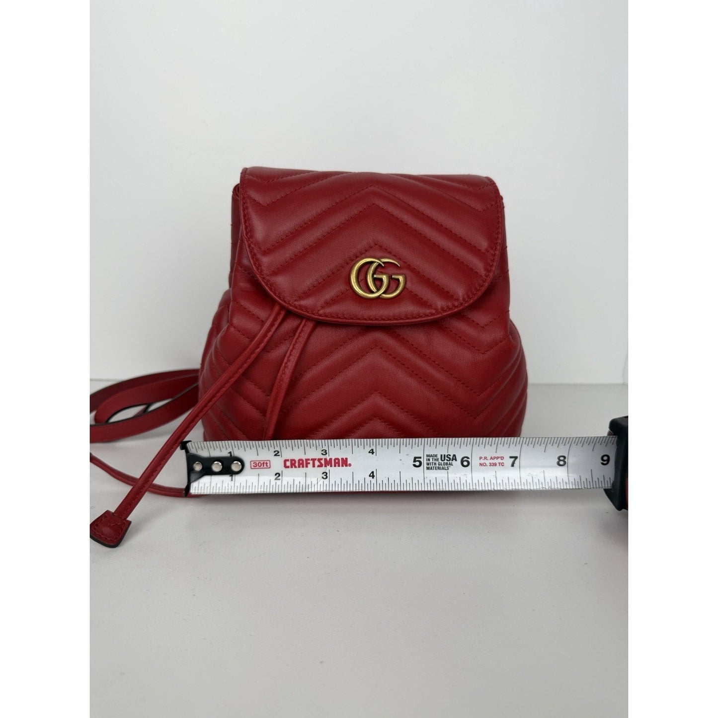 Gucci Marmont Drawstring Mini Backpack Matelasse Leather Red