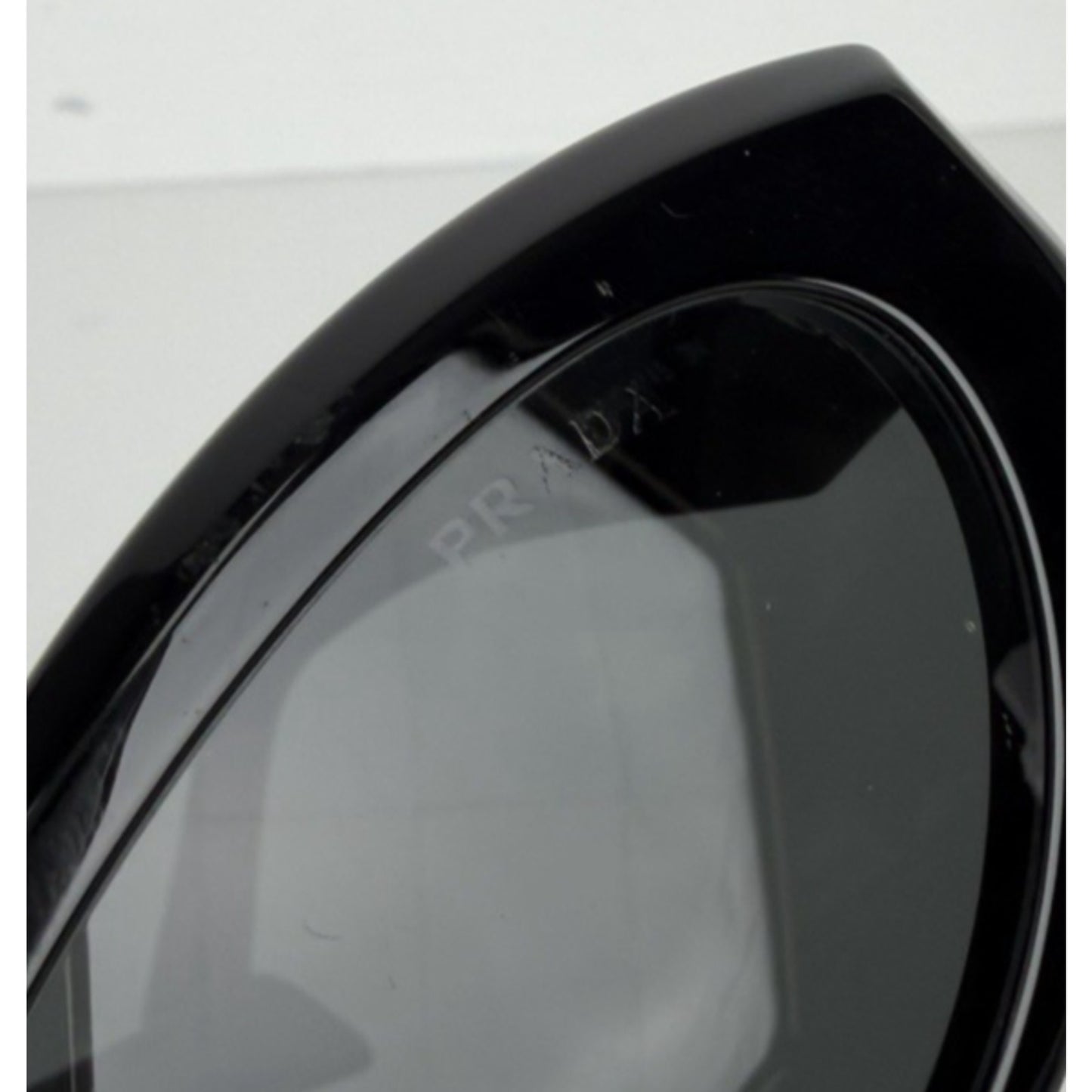 Prada Symbole Oval Car-Eye Sunglasses 55 in Black with Dark Gray Lenses
