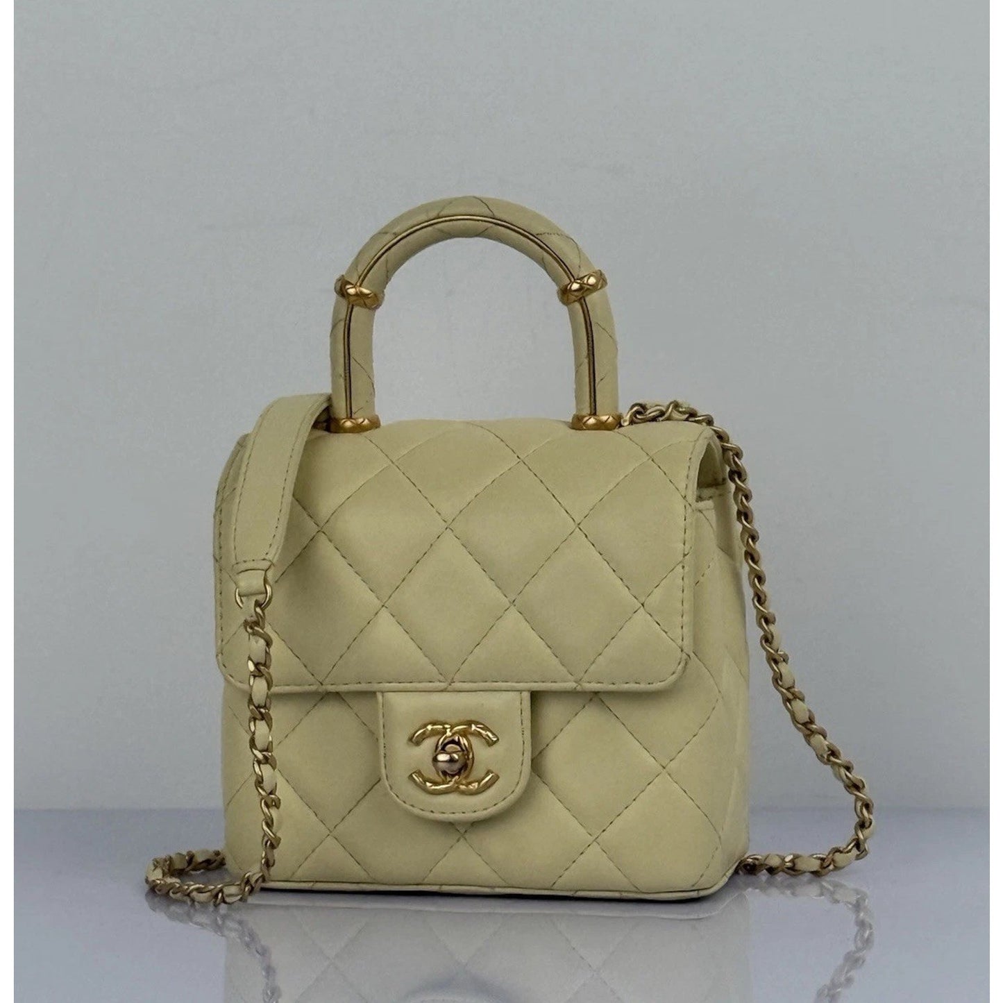 CHANEL Crush Quilted Leather Mini Top Handle Flap Bag in Yellow
