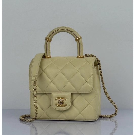 CHANEL Crush Quilted Leather Mini Top Handle Flap Bag in Yellow