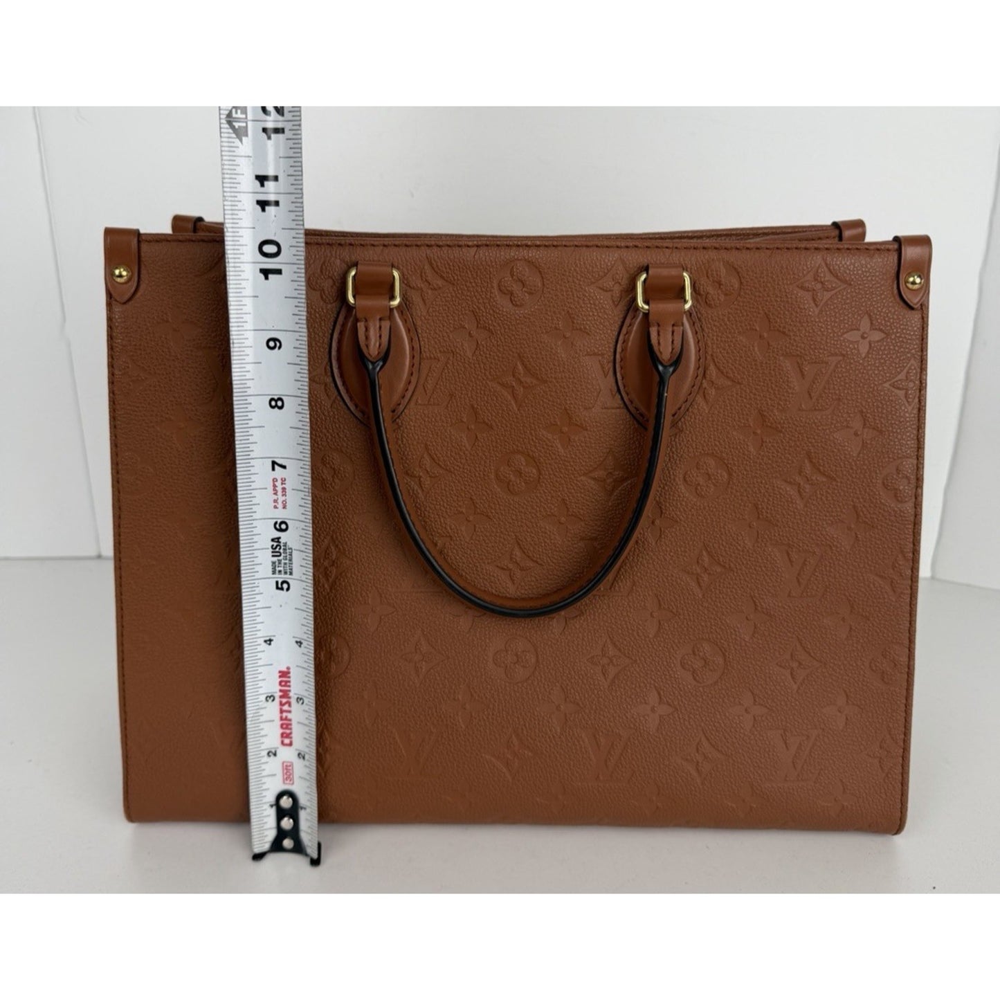 Louis Vuitton OnTheGo MM Tote Bag in Cognac Monogram Empreinte Leather D9