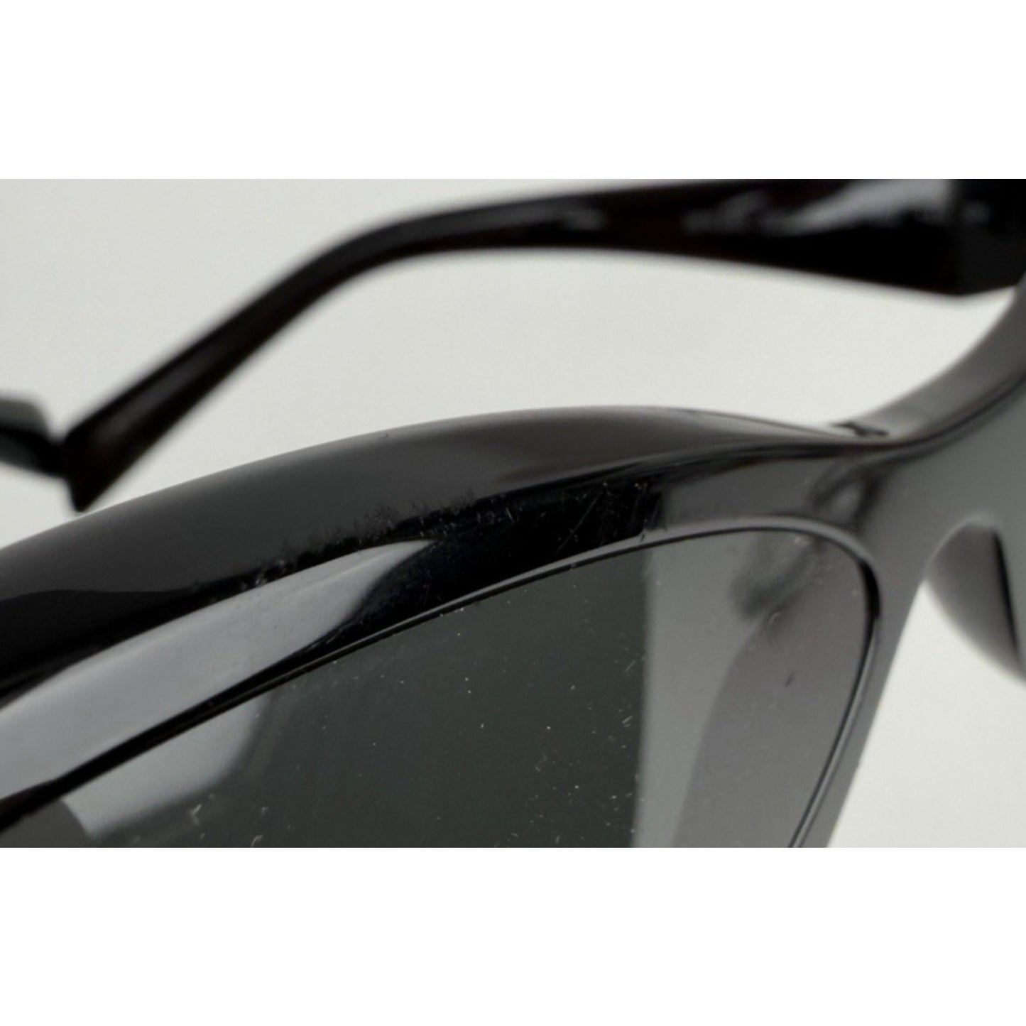 Prada Symbole Oval Car-Eye Sunglasses 55 in Black with Dark Gray Lenses