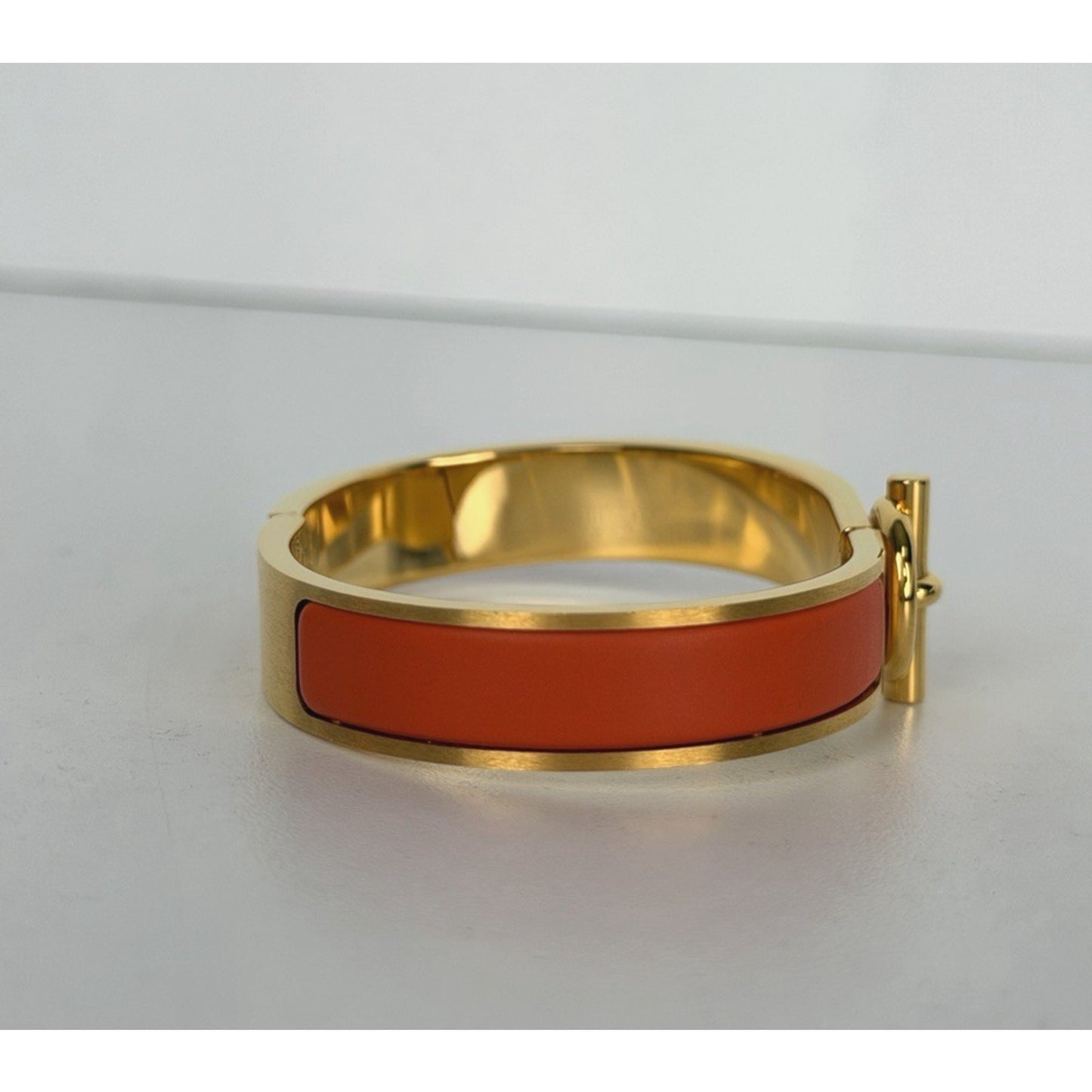 Hermes Clic H Bracelet in Orange Enamel