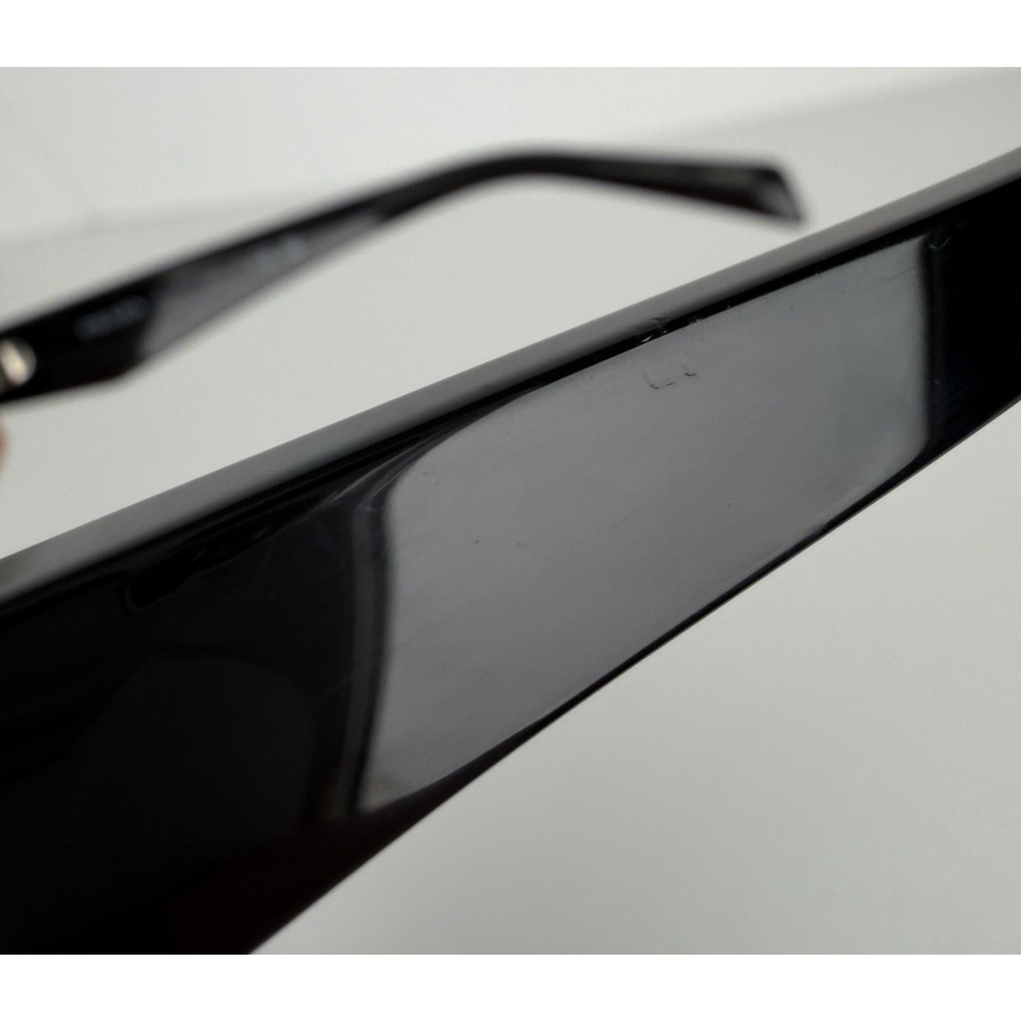 Prada Symbole Oval Car-Eye Sunglasses 55 in Black with Dark Gray Lenses