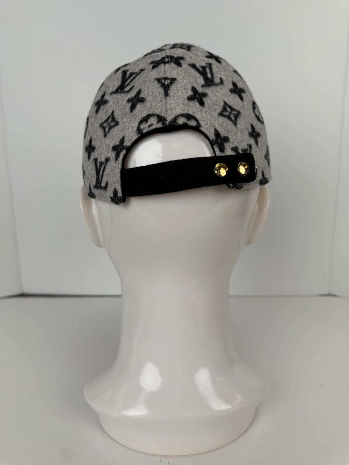 Rear view showing adjustable strap and gold-tone studs