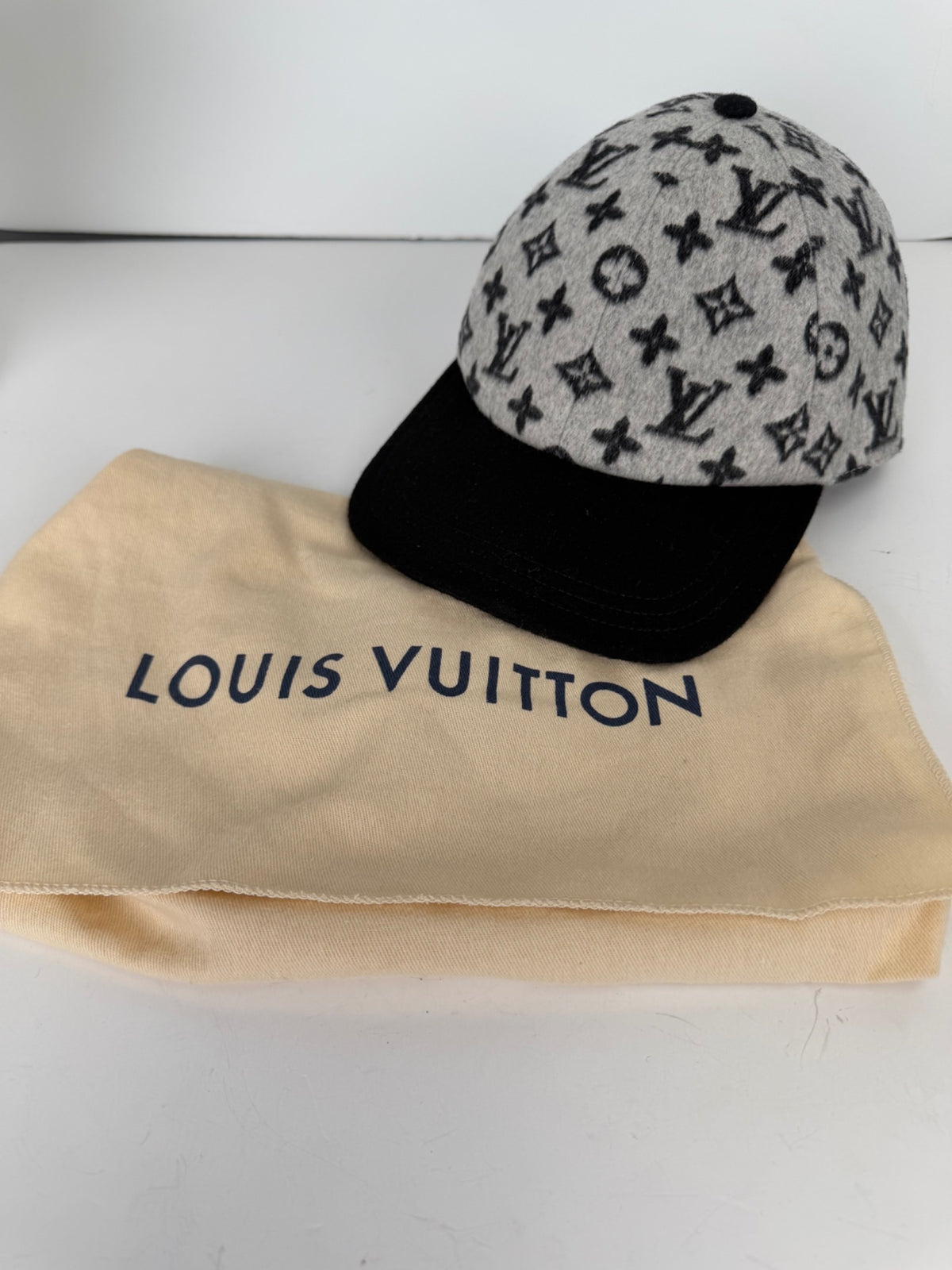Hat photographed with Louis Vuitton dust bag